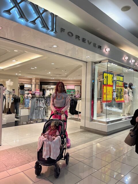 11-month old daughter in a stroller as the two exited the Forever 21 store at Cherry Hill Mall